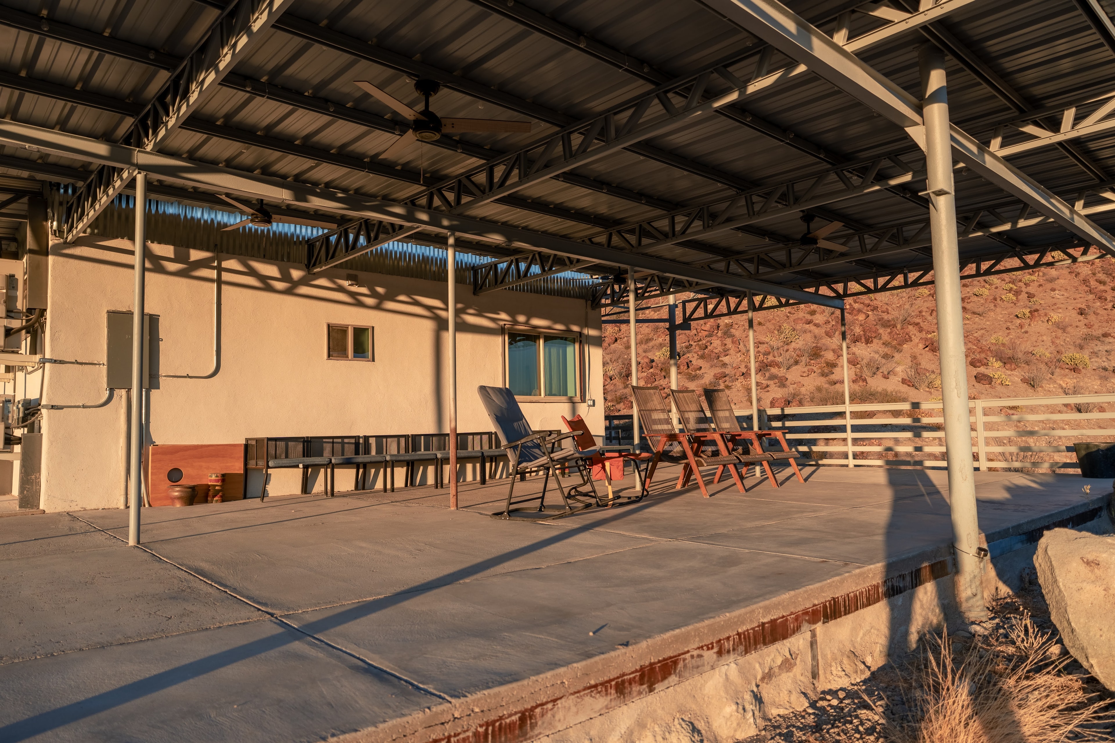 Desert ranch patio with lounge chairs