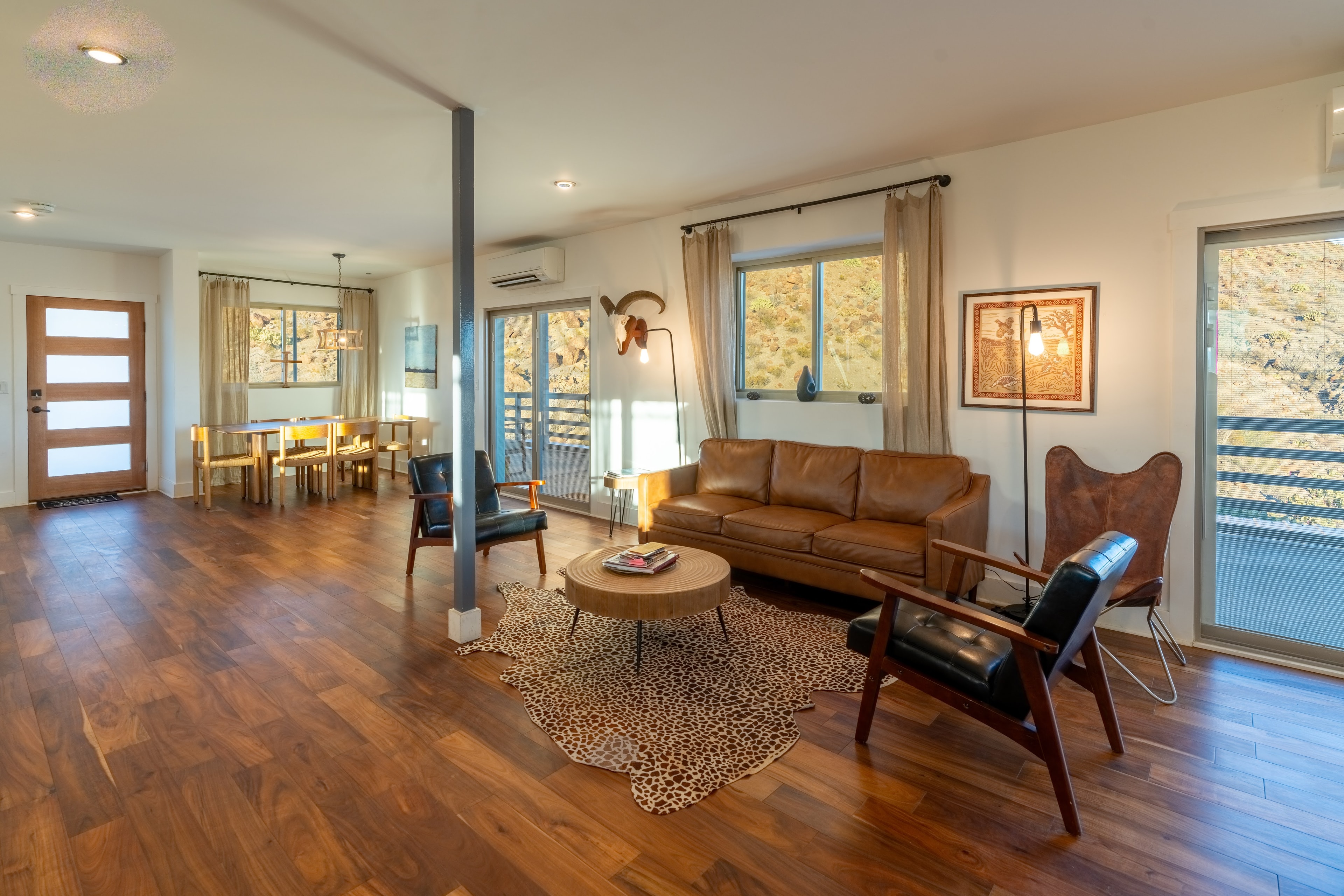 Modern open concept living room with leather sofa