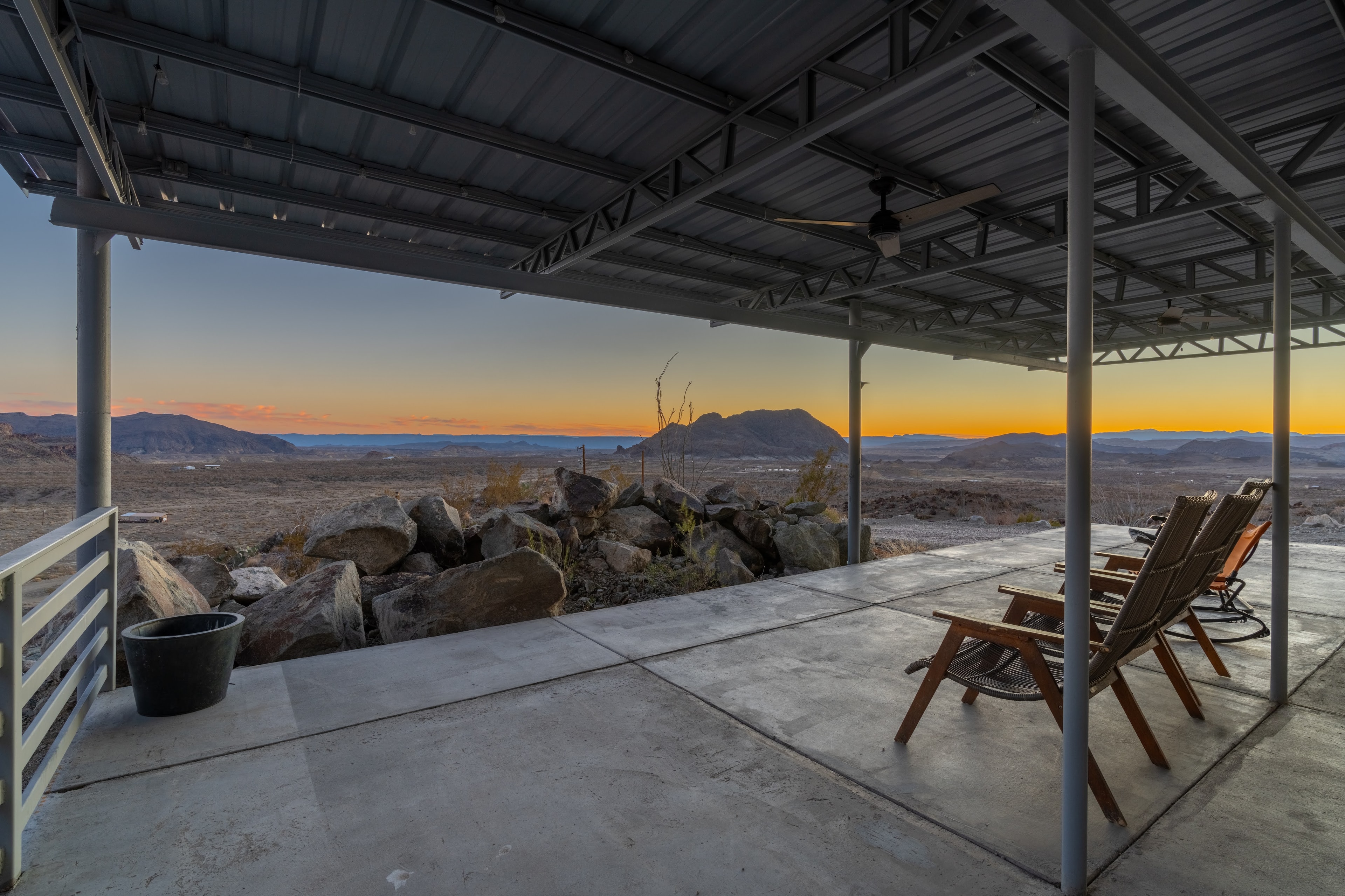 Desert patio overlooking mountains at sunset